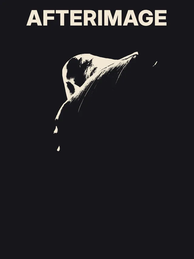 At the higher threshold, much of the flower disappears into the dark ground, leaving a thin pale fold and scattered highlights.